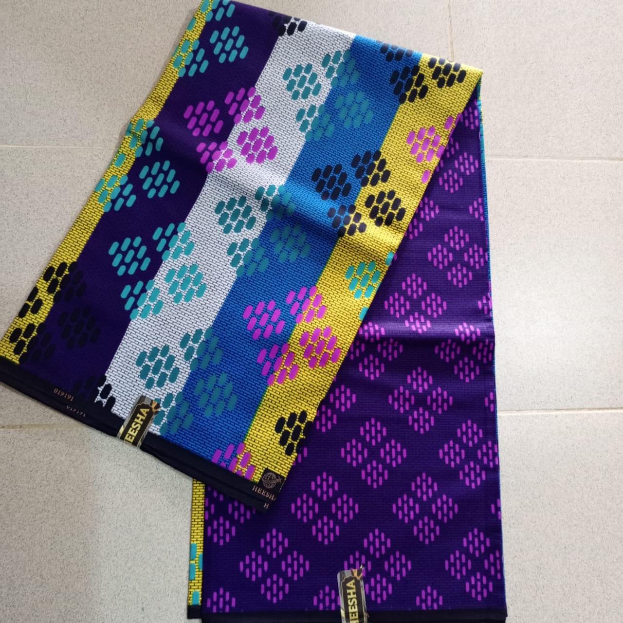 HEESHA 100%COTON WAX NIGERIAN de couleur bleu nuit, violet, or et turquoise avec motifs diamants traditionnels